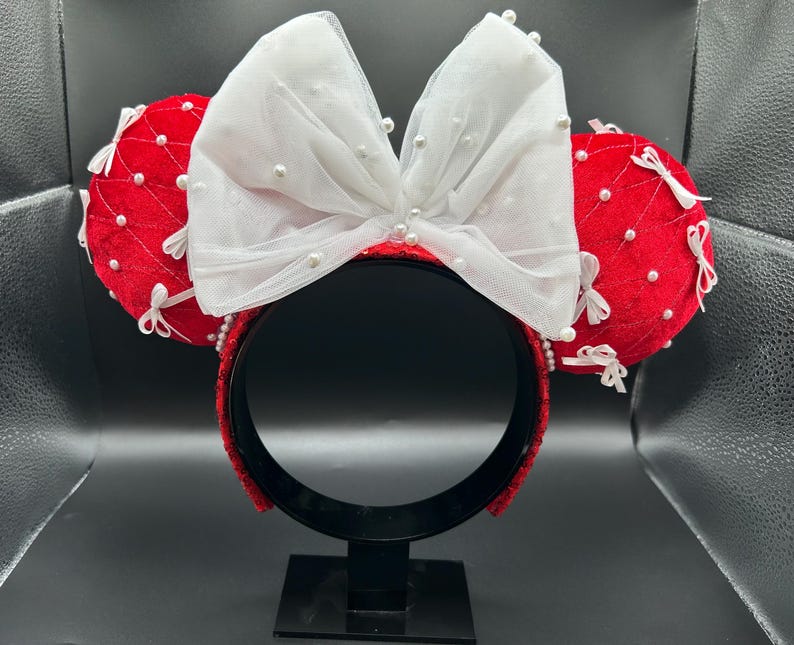 Handmade ear headband detail — hand-set crystals and sequin fabric